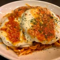 Eggplant Parmigiana · Made or covered with Parmesan cheese.
