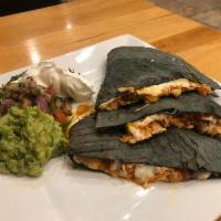 Mexican Quesadilla · Chicken tinga (shredded chicken) seasoned tomato, onions chipotle sauce and low-fat fresh mo...