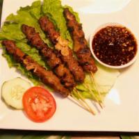 Chicken Satay · Sate ayam. Grilled marinated chicken on skewer served with peanut sauce on top.
