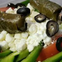 Greek Salad · Cucumber, tomato, black olives, green pepper, onion, feta	cheese and grape leaves.