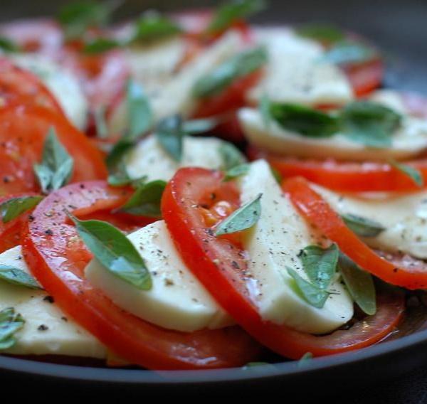 Mozzarella and Tomato · Fresh mozzarella paired with sliced tomatoes, fresh basil and olive oil.