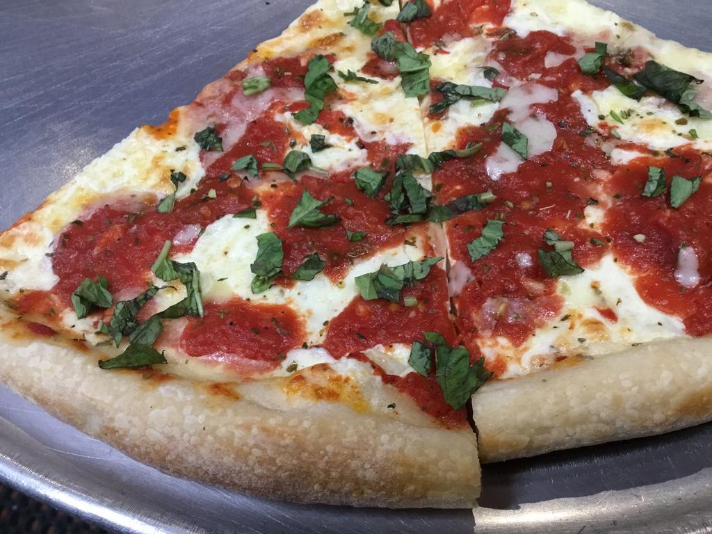 Margherita Pizza · Extra virgin olive oil with garlic, basil, crushed tomatoes, mozzarella and grated Parmesan.