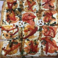Crostini Pie · Fresh mozzarella, roasted peppers, tomato and balsamic glaze. Square pizza. Serves 4-6.