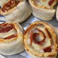Pepperoni Pinwheel · Homemade pizza dough and pepperoni rolled up, then sliced into thick pieces. Baked golden br...
