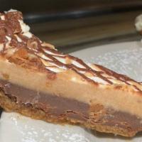 Snicker's Pie · Chunks of Snicker's bars, fudge brownie, caramel, peanuts, and tart cream cheese filling.