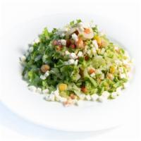 Chopped Salad · Romaine lettuce, tomato, heart of palm, red onion, corn, cucumber, feta cheese, chick pea, c...