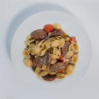Orecchiette Pasta · Bucatini, spicy Italian sausage, Parmigiano-Reggiano,heirloom cherry tomato, fresh cracked p...