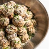 Chicken and Broccoli Rabe Meatballs · Three chicken meatballs studded with broccoli rabe, fennel, pecorino romano, and garlic.