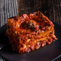 Lasagna Bolognese · Thin pasta sheets layered with marinara, mozzarella, and homemade beef bolognese sauce. Appr...