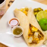 Potato-Egg & Cheese Taco · Folded tortilla with a variety of fillings such as meat or beans. 
