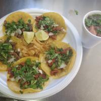 Combo Tacos · 5 mini tacos, choice of meat with cebolla, cilantro, grilled onions, and small charro beans....