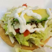 Sopes · Beans, cheese, avocado, lettuce, tomatoes, sour cream, choice of meat, and salsa.