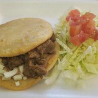 Gordita · Beans, cheese, choice of meat, lettuce, tomatoes.