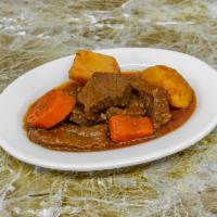 Beef  stewed  (res Guisada · Acompanada  con arroz  y habichuela