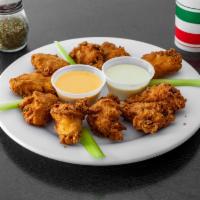 Buffalo Wings · Mild or hot includes blue cheese dressings on side.