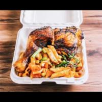 Jerk Chicken Penne with Red Sauce · Jerk chicken on top of spaghetti in red sauce, onion, green peppers, green beans, and corn.