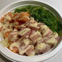Seafood Fun Poke · Salmon, Yellowtail, Seaweed Salad, 
Wasabi Mayonnaise Sauce and White Sesame Seeds
