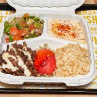 Shawerma Plate · Flame-broiled, marinated beef with rice pilaf, roasted tomato, piaz, garden salad, and tahin...