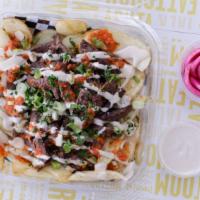 Shawerma Fries · Flame-broiled, marinated beef piled on fresh hand-cut fries, drizzled with tahini sauce.