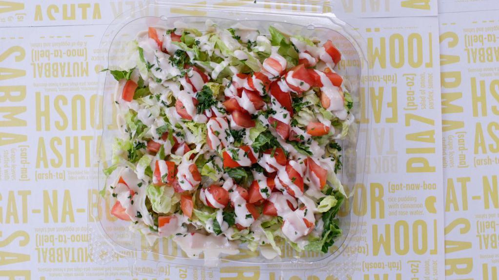 Tahini Salad · Shredded lettuce with chopped tomato, drizzled with tahini sauce. Vegan, Gluten Free. 