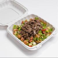Shawerma Salad · Flame-broiled, marinated beef served over fresh garden salad with our house dressing.