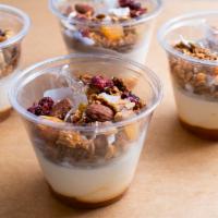 Muesli Granola and Yogurt · Creamy yogurt topped with Breads housemade granola.