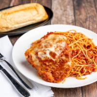 Chicken Parmigiana Dinner · Breaded chicken breast with red sauce and mozzarella, baked to perfection. Served with a sid...