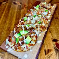 California Chicken Flatbread · Grilled chicken, bacon bits, caramelized onions, pepper jack cheese, avocado, topped with ch...