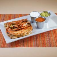 Quesadilla · Grilled flour tortilla filled with spinach, Monterey jack cheese, tomato, scallions, and jal...