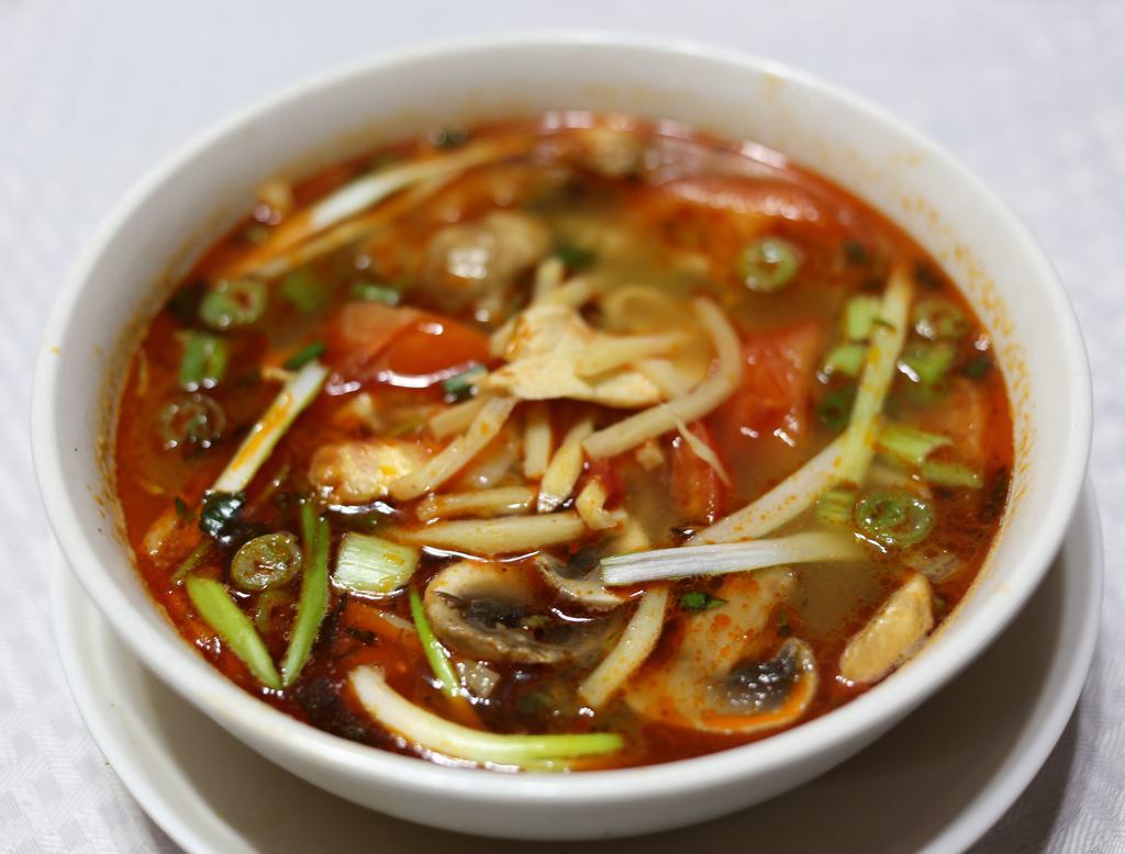 17. Spicy and Sour Soup (Tom Yum)with rice · Tom yum. Bamboo, mushroom, basil, lemongrass, and lime juice. Served with rice.