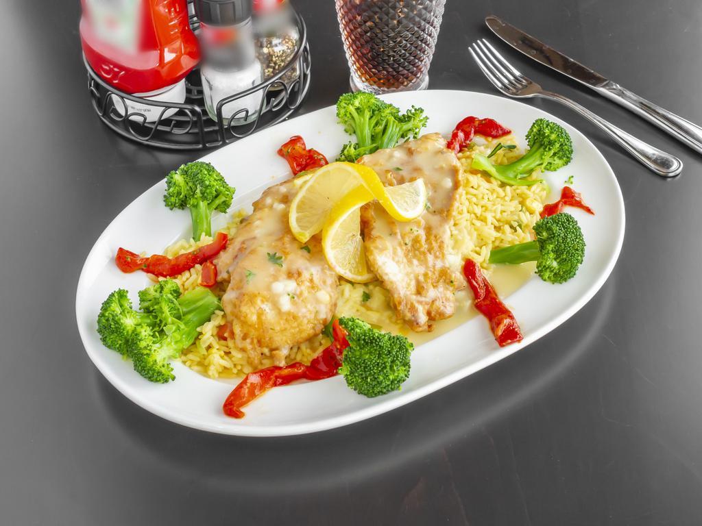 Chicken Francaise · Dipped in egg batter and sautéed with white wine lemon butter sauce with broccoli, served over rice.