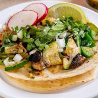 Veggie Taco (Order of 3) · A mix of grilled zucchini, portobello mushroom, green peppers, and grilled onions. Tacos top...
