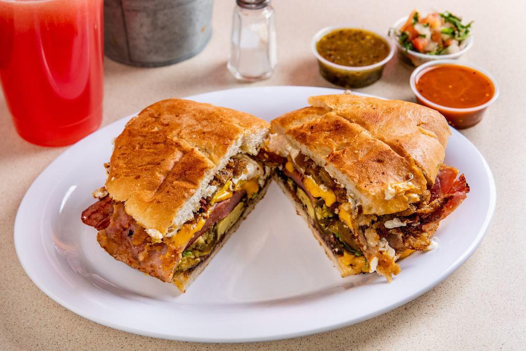 Chorizo Torta with  Cheese · Grilled traditional Mexican sausage. Traditional Mexican sandwich, served on a Telera toasted bread, coated with refried beans and mayo, with sliced tomato, onions, jalapeno and fresh avocado.