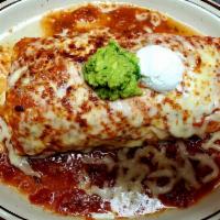 Wet Burrito · Un burito grande de carne al gusto y cubierto con nuestra salsa. A big burrito stuffed with ...