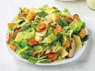 Regular Chicken Caesar Salad · Fresh-cut lettuce blend, cheddar cheese, black olives, red onions, green peppers, sliced tomatoes and croutons made daily; served with ranch dressing.