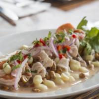 Ceviche Mixto · Fresh fish chunks and shrimp calamari marinated in rocotto and leche de tigre served with a ...