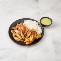 Pollo Saltado · Traditional Peruvian style stir fry chicken and sauteed with onions. Tomatoes, cilantro, fre...