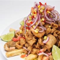 Jalea · Peruvian fried seafood platter served with fried yuca and topped with salsa criolla.