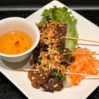 4. Grilled Satay Skewers  · grilled meat skewers with caramelized onions and toasted peanuts, served with dipping sauce....