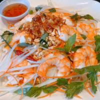 11. Green Papaya Salad · Shredded green papaya with shrimp, carrots and Vietnamese coriander, tossed in tangy lime vi...