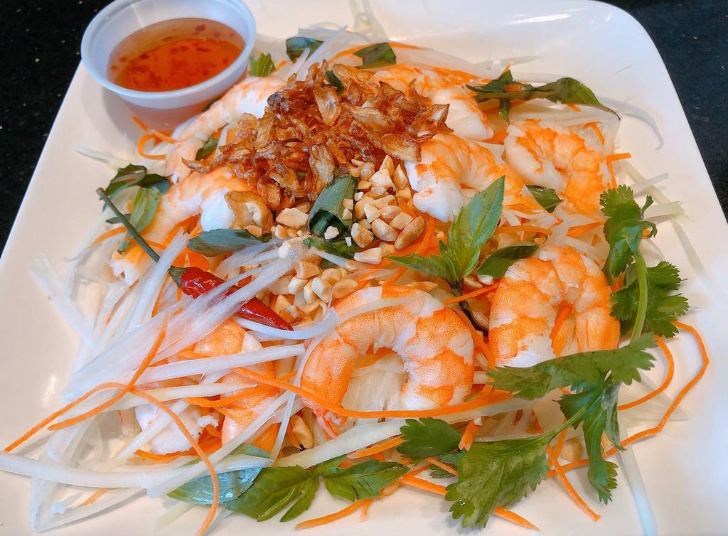 11. Green Papaya Salad · Shredded green papaya with shrimp, carrots and Vietnamese coriander, tossed in tangy lime vinaigrette, topped with toasted peanuts and fried shallots. ***Gluten-free upon request.