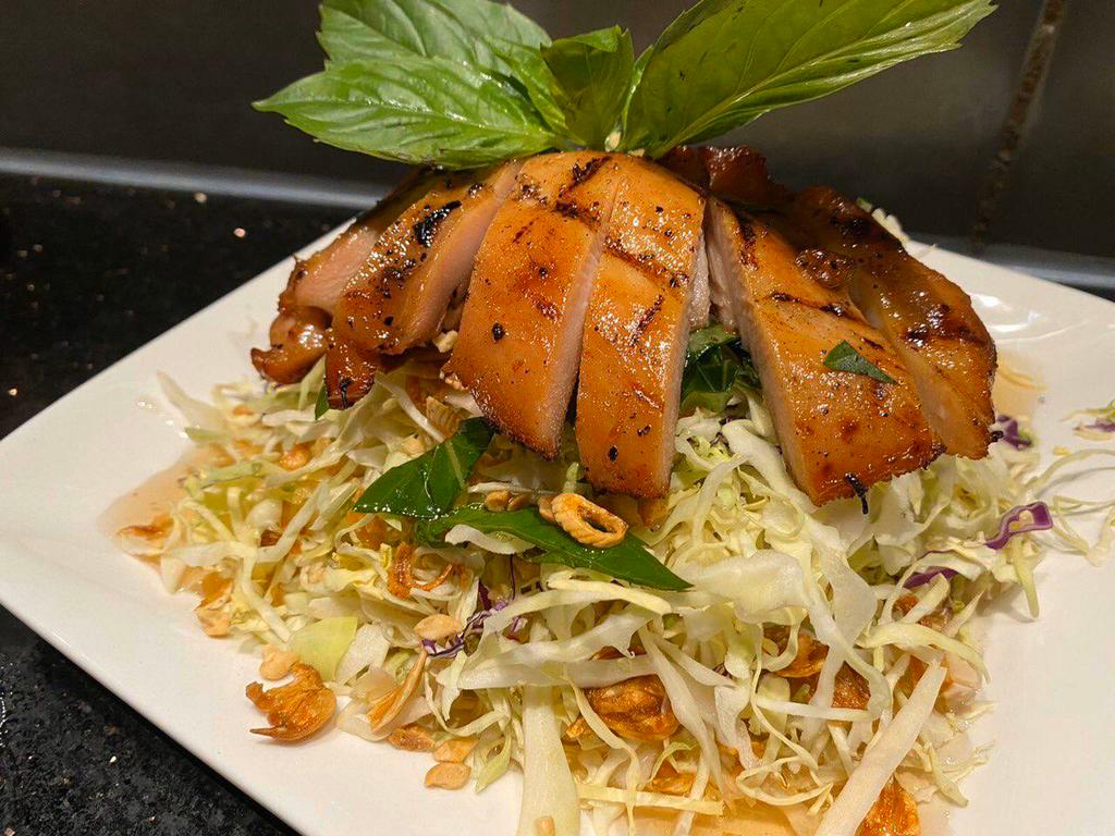 12. Cabbage Chicken Salad · Chopped red and green cabbage with sauteed chicken, tossed in tangy lime vinaigrette topped with peanuts and fried shallots.
