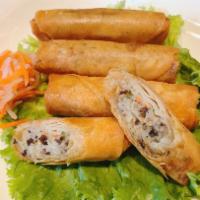9. Crispy Spring Roll · Crispy rolls stuffed with pork, carrots, and taro, served with fish sauce.