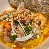 20. Da Nang Tumeric Noodle · Seasoned turmeric broth ladled over wide rice noodles, minced pork, shrimp and diced jicama ...