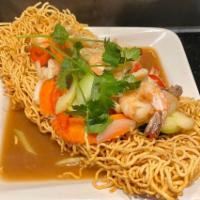 36. Seafood Bird's Nest · Stir fried tiger prawns, calamari, mushrooms and garden vegetables tossed in rice wine and o...