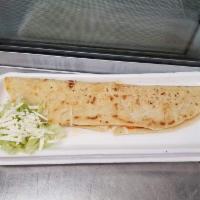 Machete Regular · Traditional home made tortilla fill with cheese serve with lettuce and tomato.