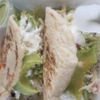2 Gorditas · 2 gorditas corn with refried beans choice of meat, lettuce and tomatoes, cheese and sour cre...