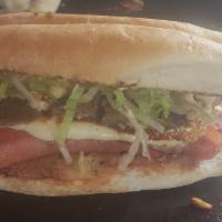 Torta · Refried beans choice of meat with grill, cheese onions, tomatoes, avocado, lettuce and chipo...