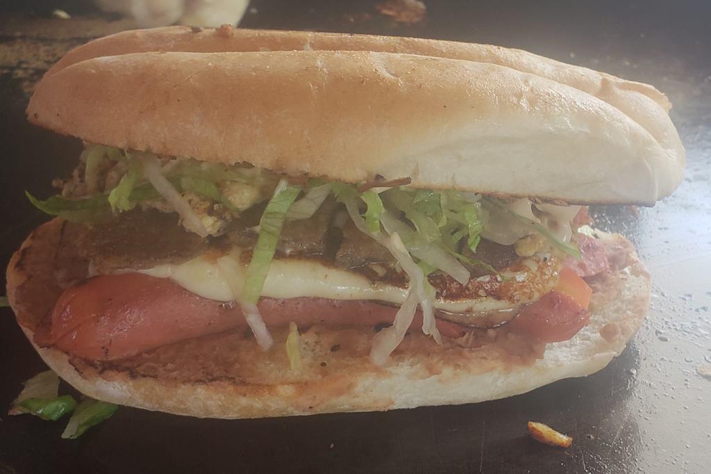 Torta · Refried beans choice of meat with grill, cheese onions, tomatoes, avocado, lettuce and chipotle mayo.