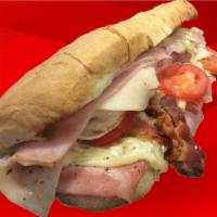 Club Sub · Turkey, ham and bacon. Dressed with lettuce, tomato, onions, smoked provolone cheese, oil an...